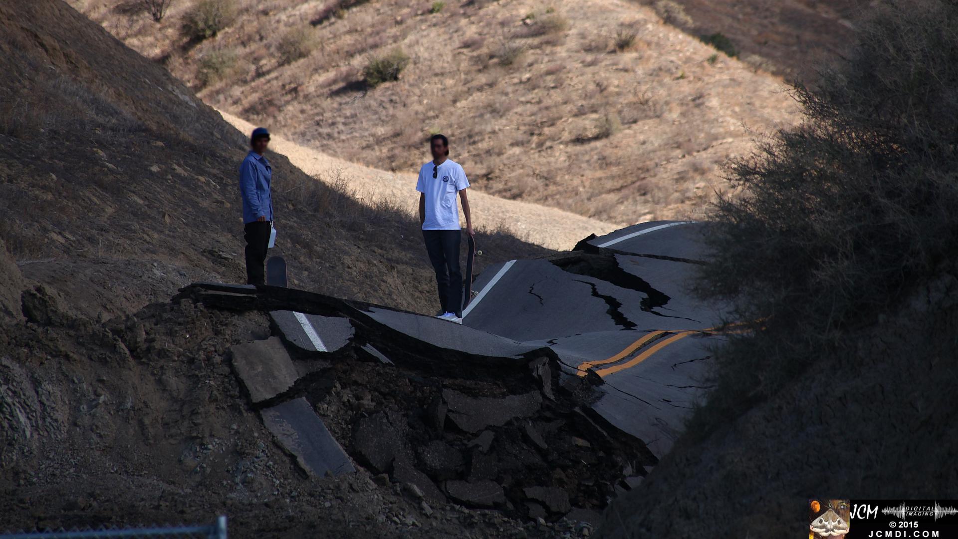 Landslide, buckled pavement, and terrain at Vasquez Canyon Road in Santa Clarita, CA filmed 11-25-2015
